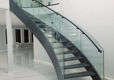 curved glass railing inside house